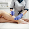 Beautiful young girl doing waxing in women salon