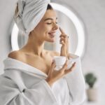 Young woman doing facial in women salon in Canada